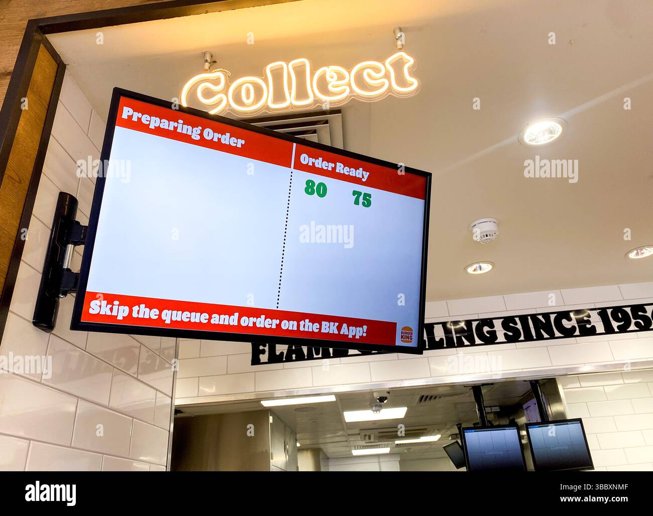 A screen at a Burger King restaurant tells you when your order is ready for collection - Smartphone Captured Stock Image