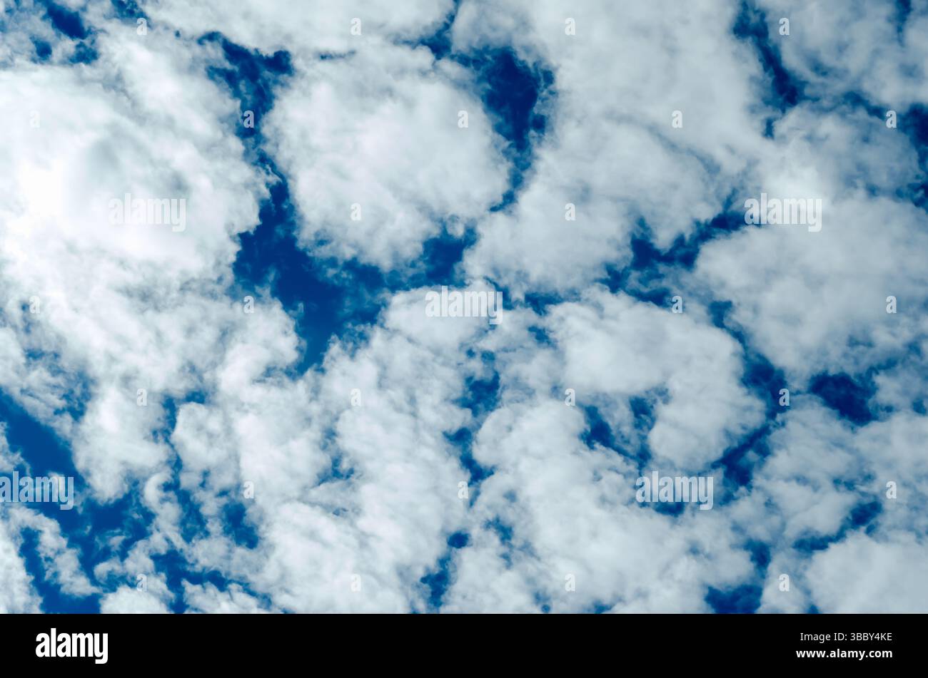 Blue Sky filled with Puffy Clouds Stock Photo