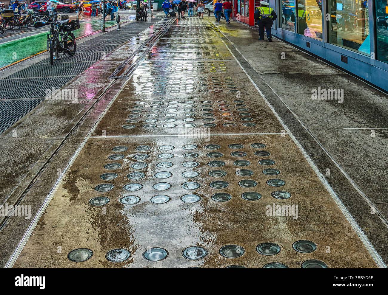 Wet sidewalk on Seventh Avenue, new York City Stock Photo