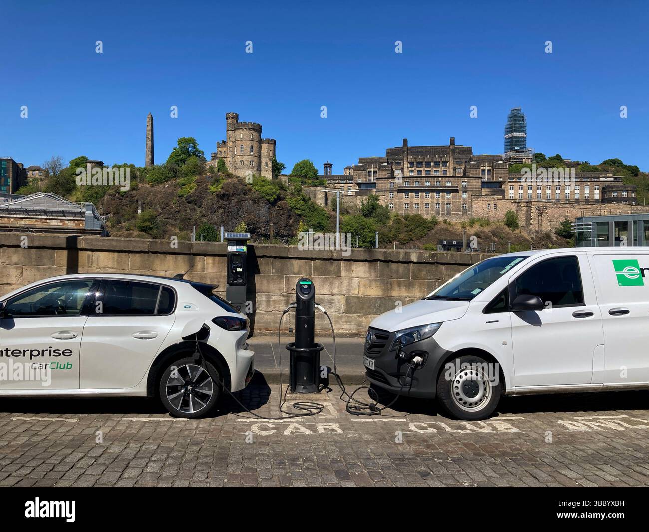 Electric vehicle EV Car charging point on street, East Market Street, Edinburgh Scotland - Smartphone Captured Stock Image