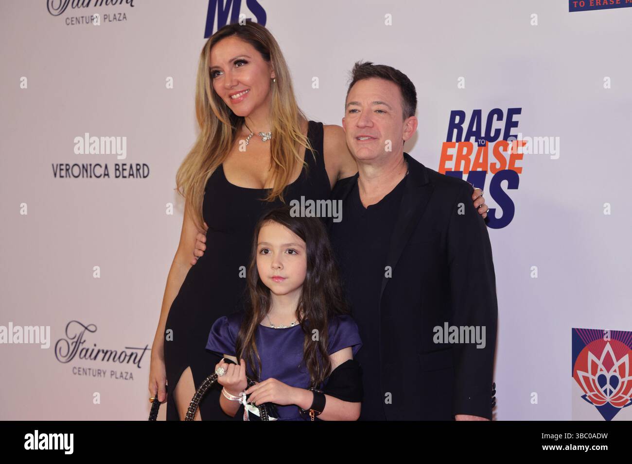 Lindsay Faustino, David Faustino, and Ava Faustino attends the 32nd