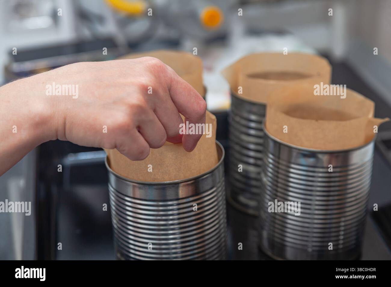 Steel molds on a roasting pan prepared for baking Easter bread. Stock Photo