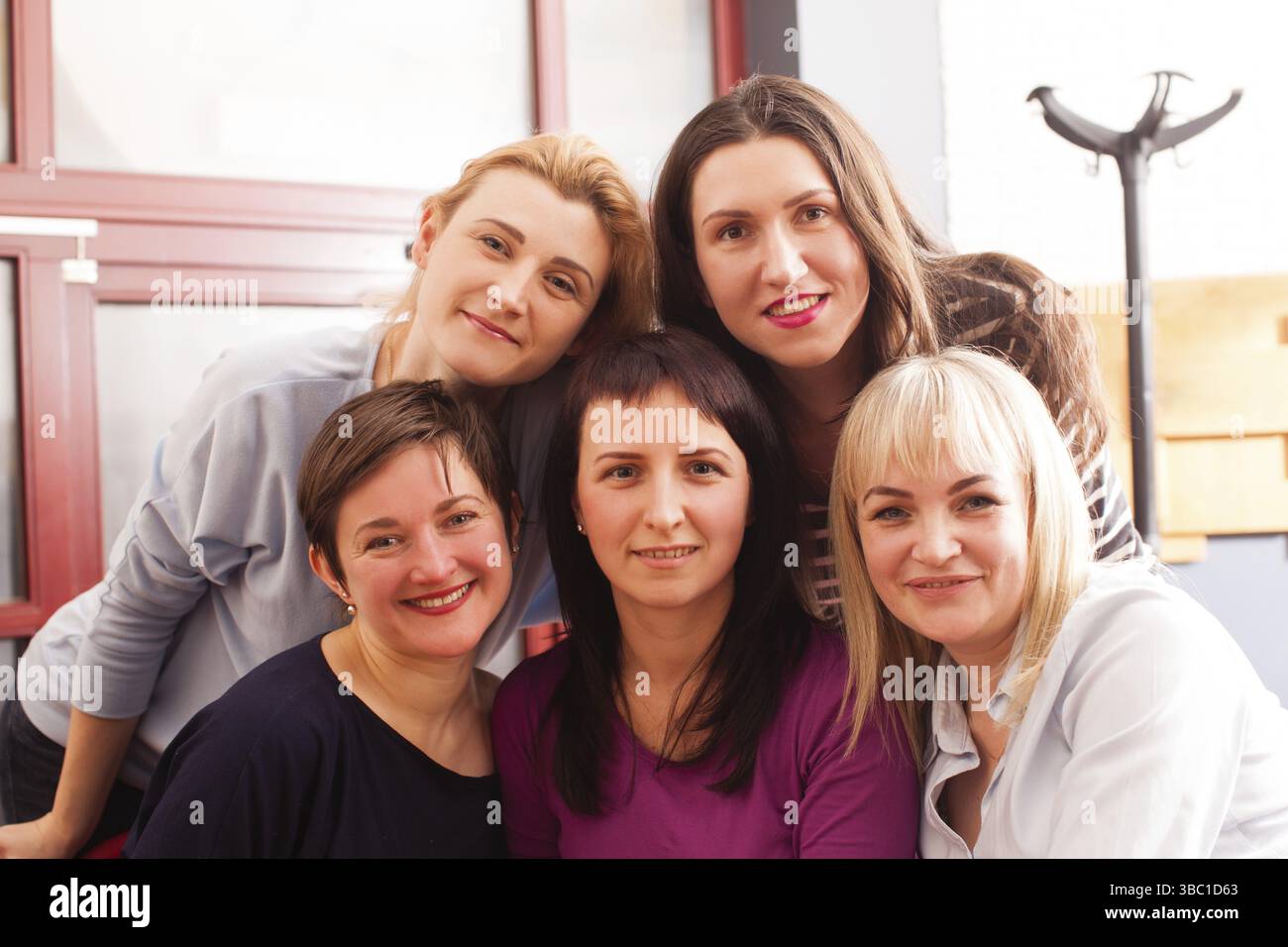 Women's team gathered at corporate meeting in a cafe Stock Photo - Alamy