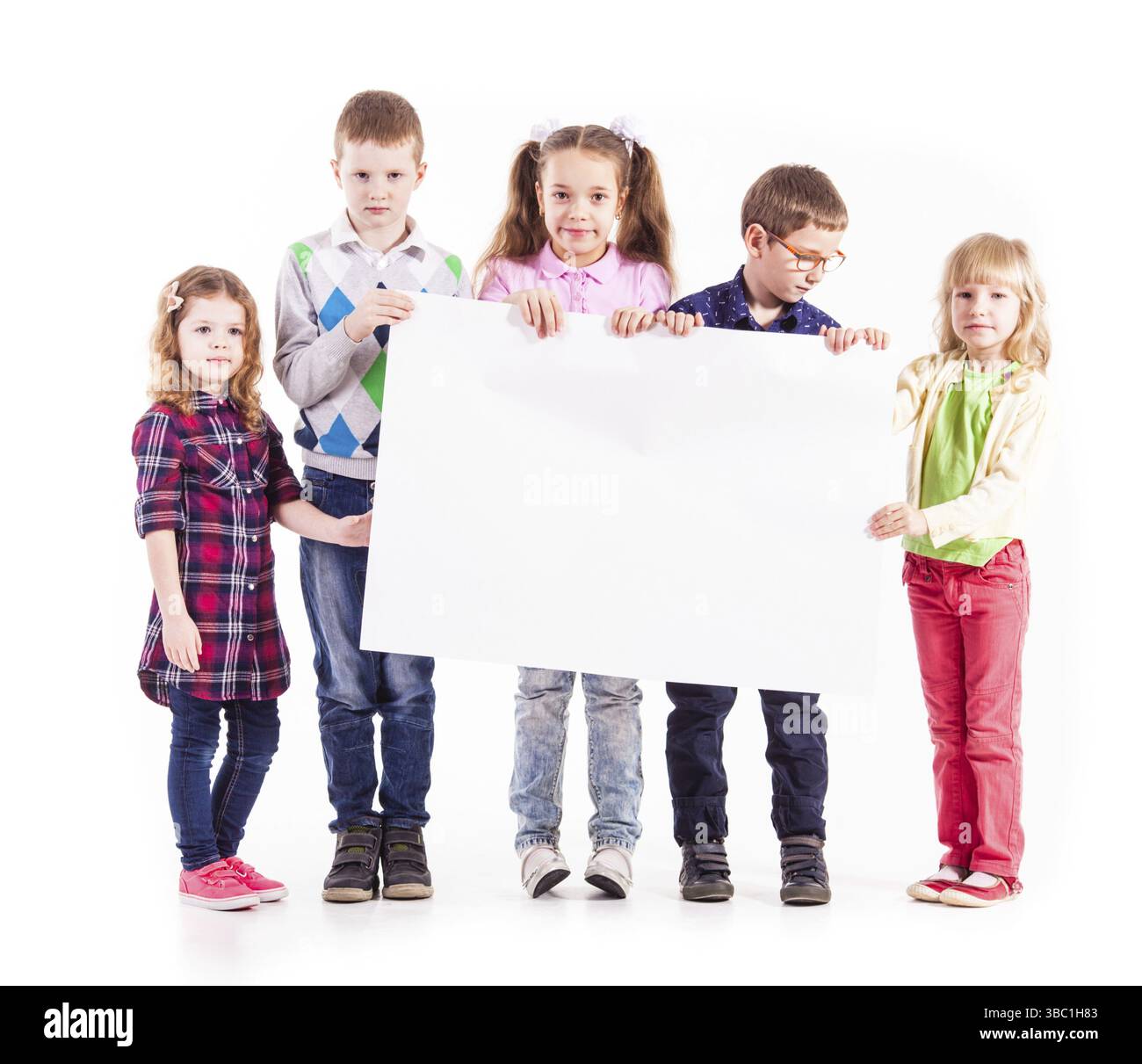 Group of children isolated on white background are holding a white ...