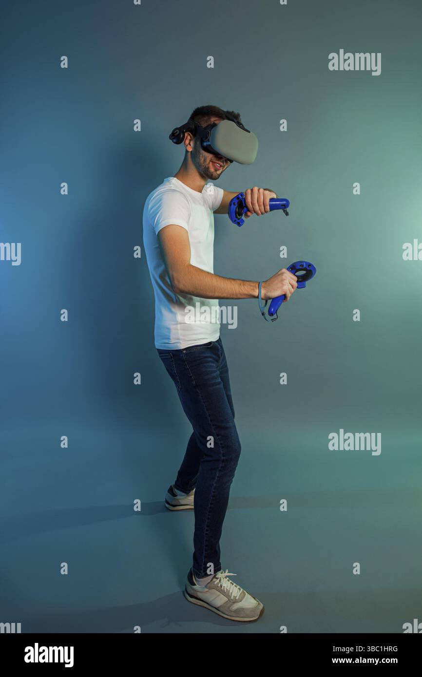Man using a gaming gadget for virtual reality. Augmented reality in gaming Stock Photo