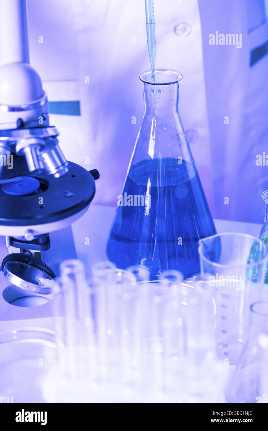 Scientist shows a diffusion in the flask Stock Photo