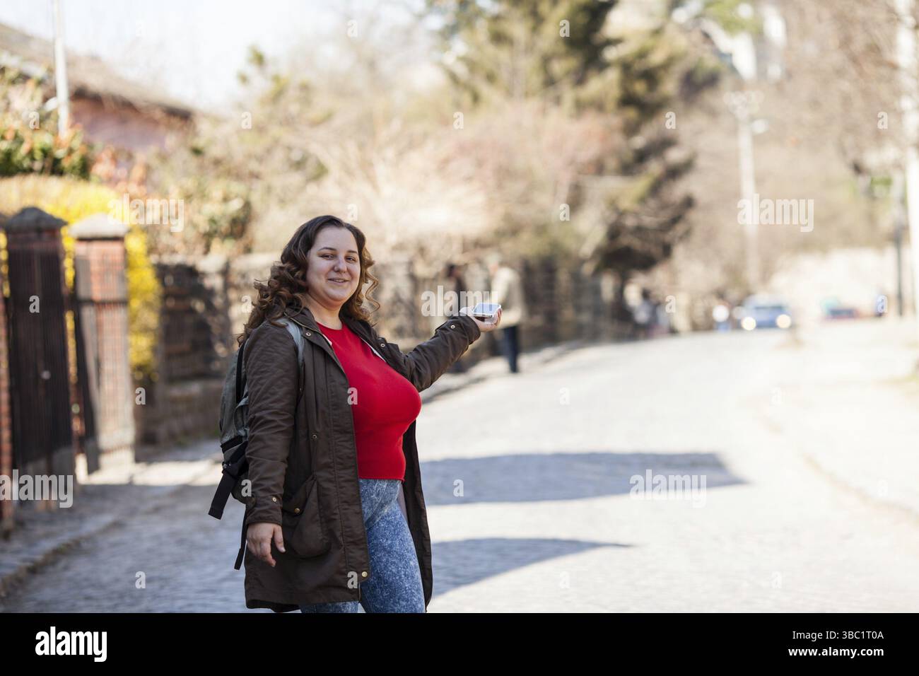 Female tourist map on hi res stock - Woman Tourist Is Using Map Location On Smartphone 3BC1T0A