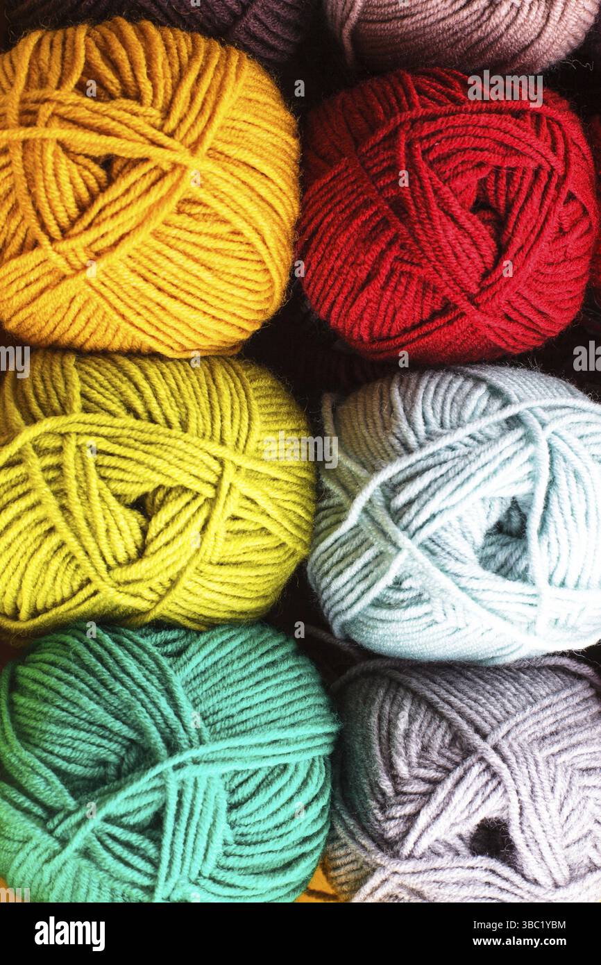 Various colors threads on rows in the store Stock Photo