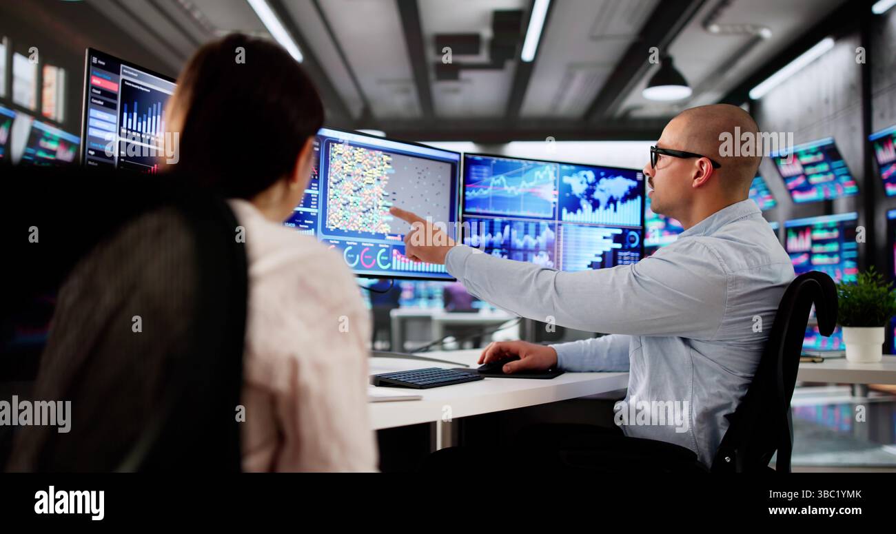 Analyzing Financial Data. A Group Of People Work Together. Stock Photo