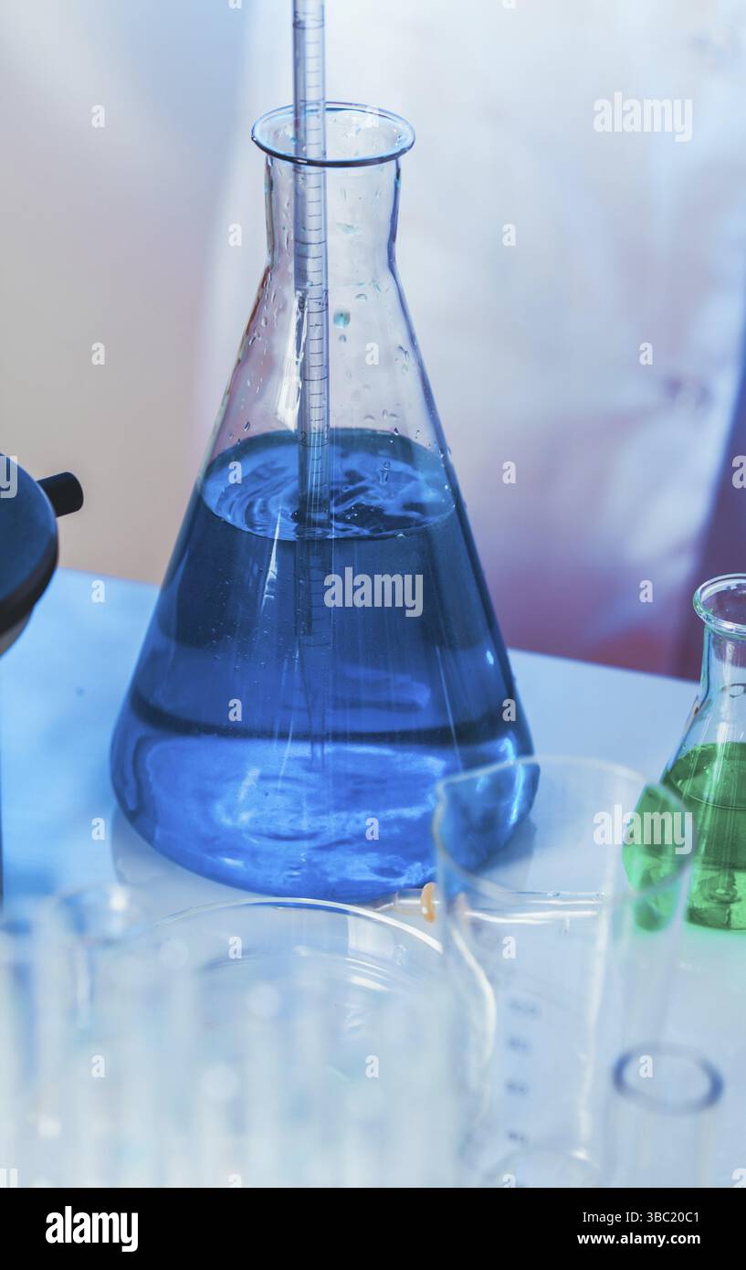 Scientist shows a diffusion in the flask Stock Photo