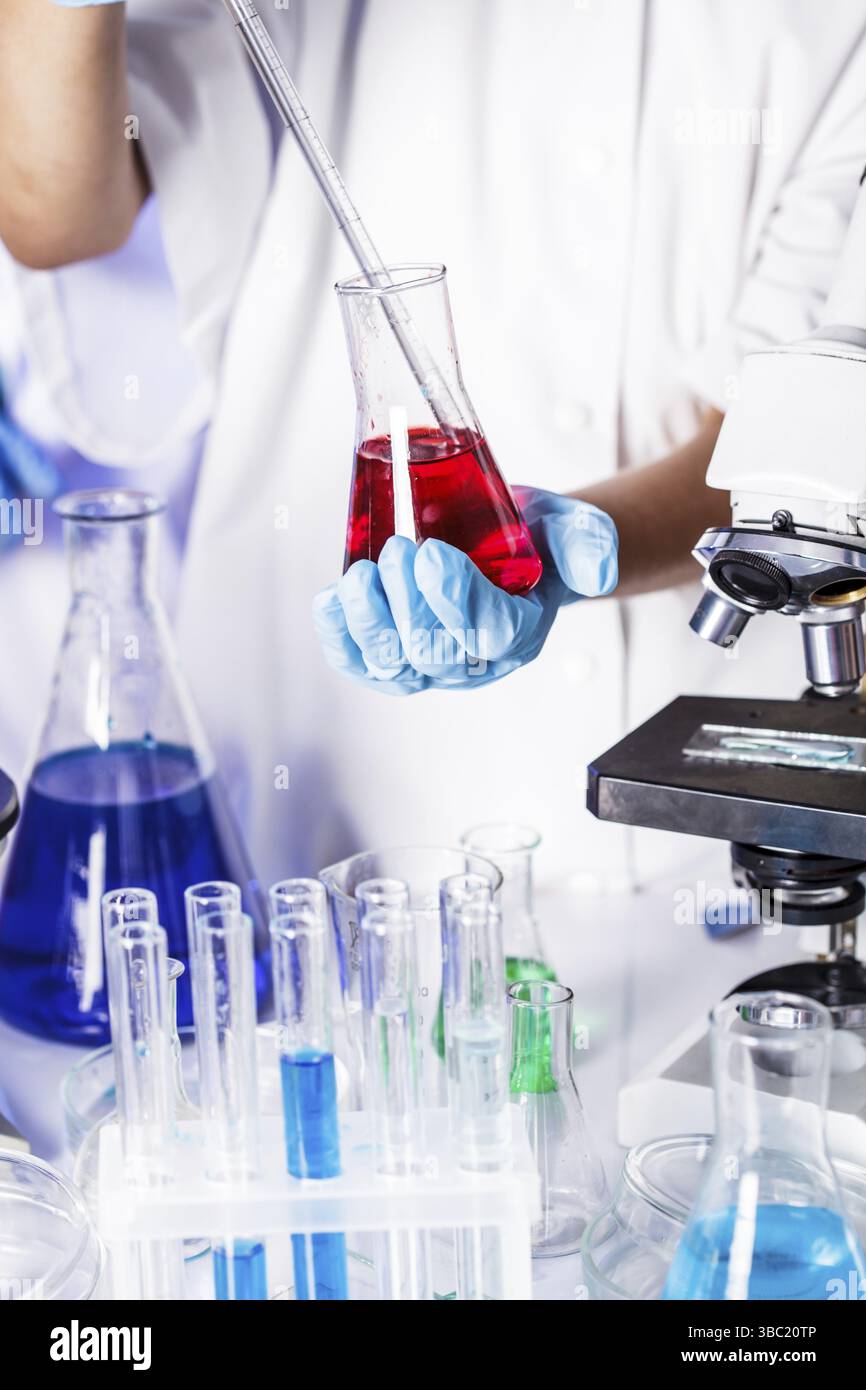 Scientist shows a diffusion in the Petri dish Stock Photo
