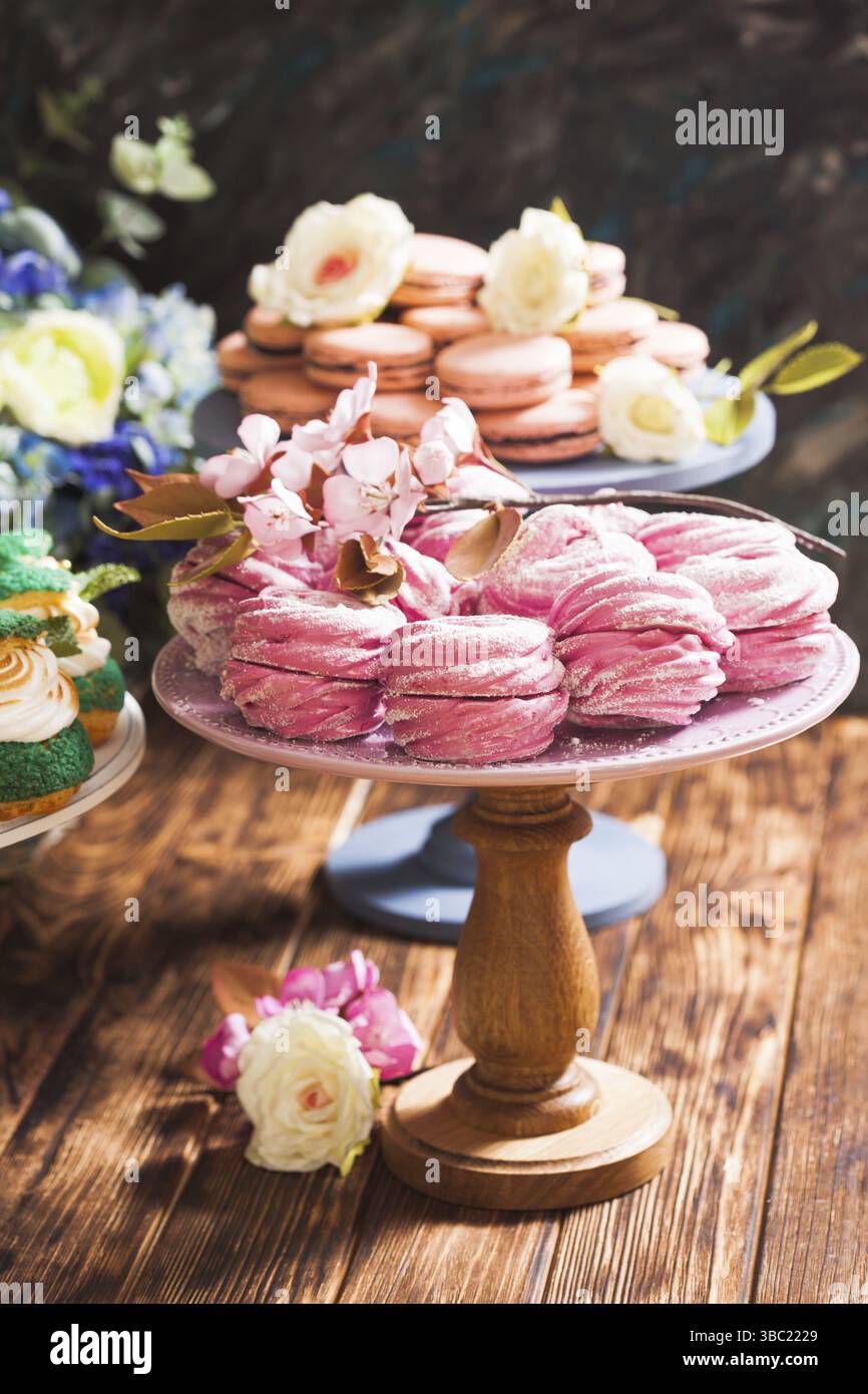 Luxury sweet desserts, decorated with sugar flowers, confectionery showcase Stock Photo