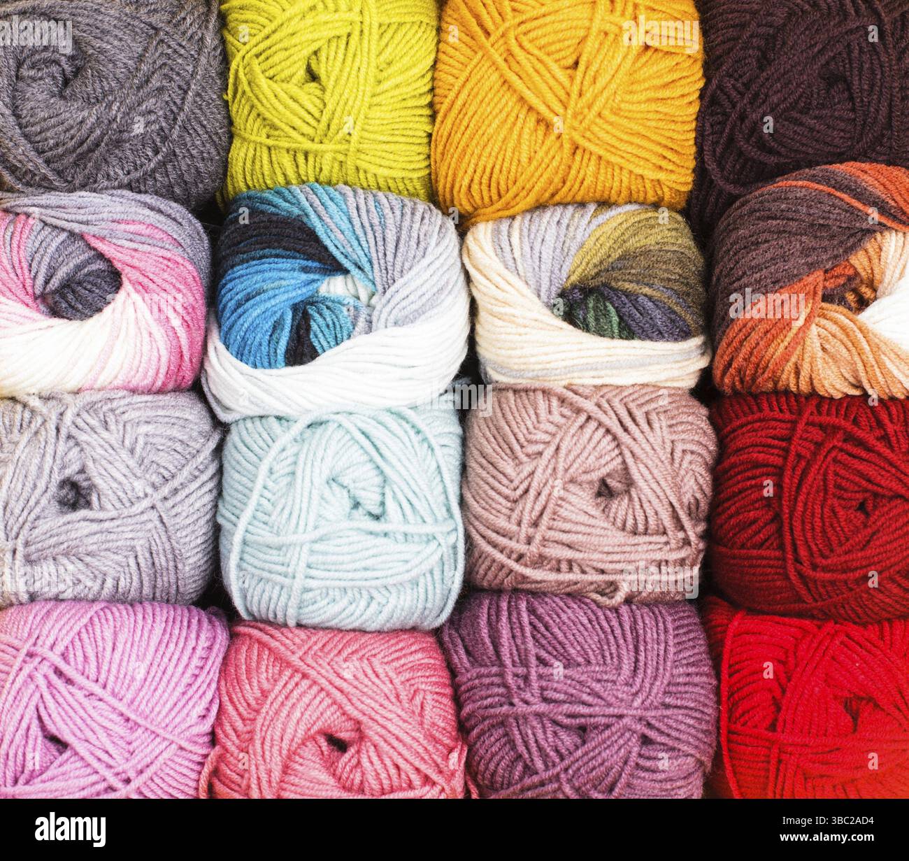 Various colors threads on rows in the store Stock Photo