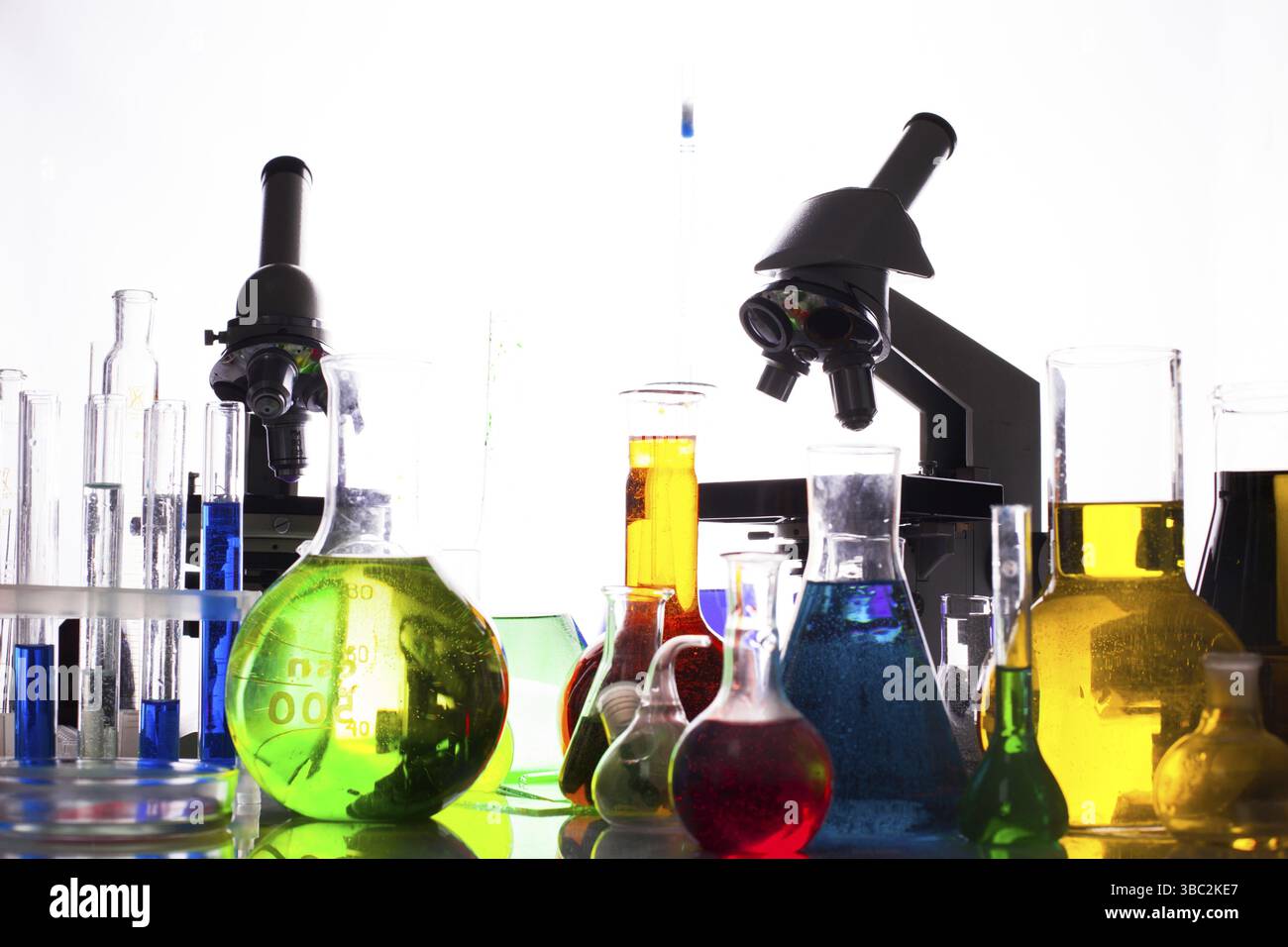 Chemistry equipment, variety of flasks and liquids Stock Photo