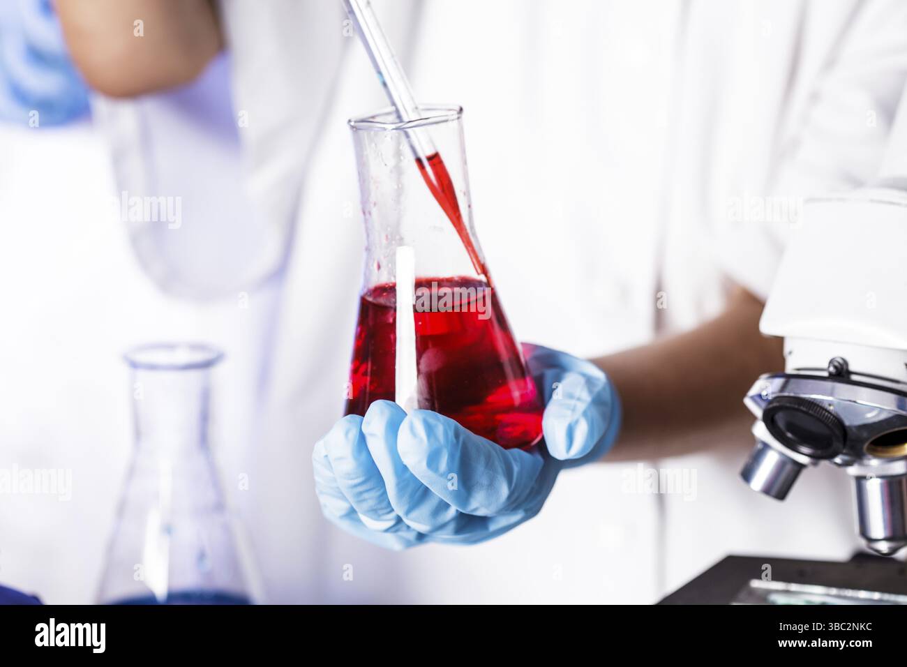Scientist shows a diffusion in the Petri dish Stock Photo