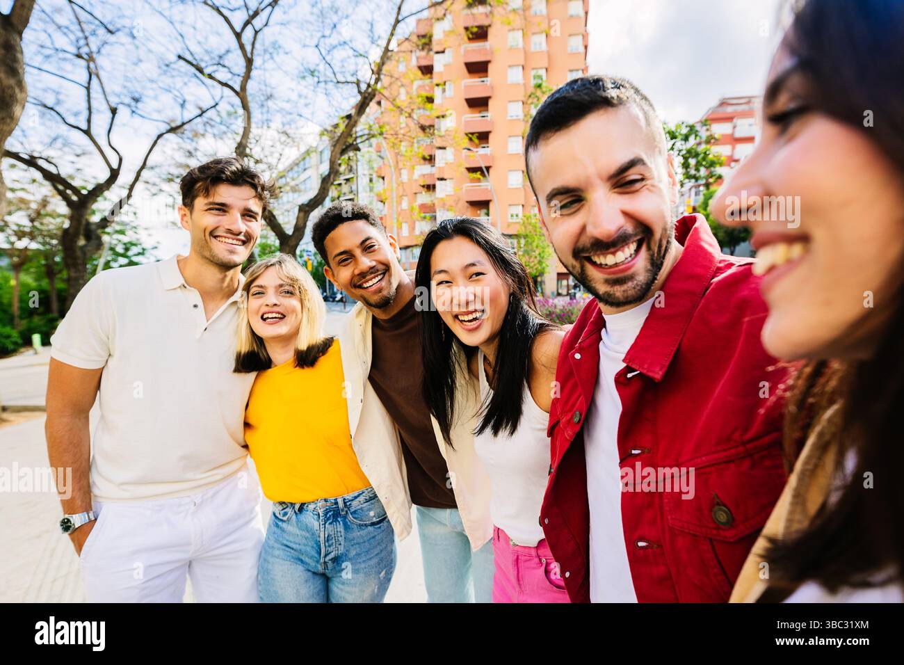 Happy group of multiracial young friends having fun together in city ...