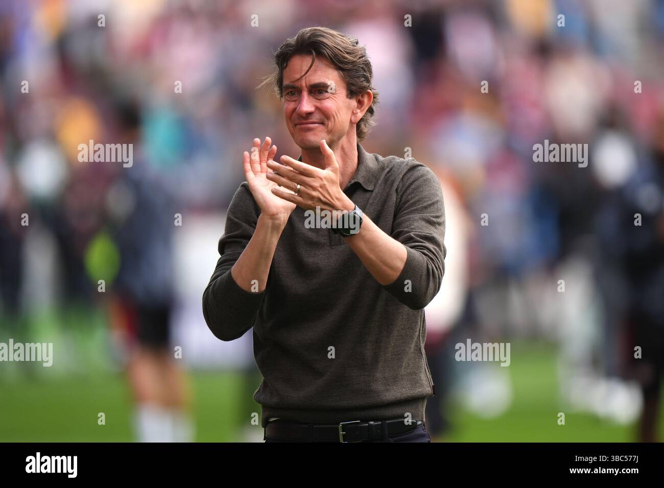 Brentford manager Thomas Frank applauds the fans after the final ...