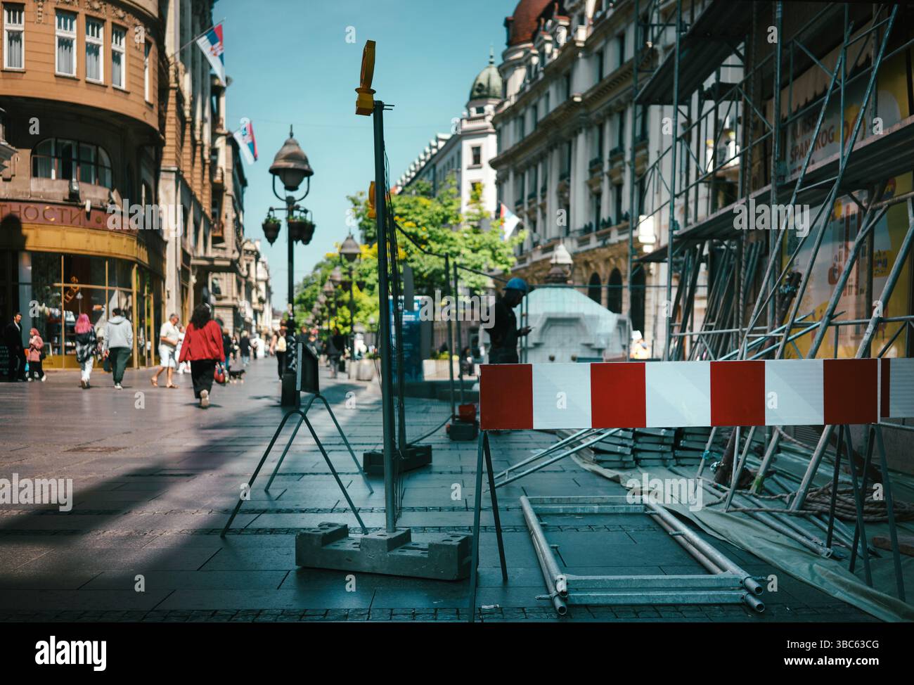 Belgrade, Serbia - May 14, 2025: Renovation of a building in Knez Mihailvoja street, sunny day with a lot of passers-by in the background. Stock Photo