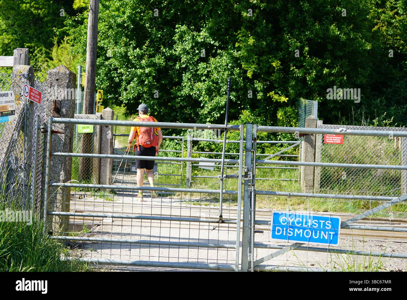 Signs at railroad crossings warning of an approaching train.Dorking, UK ...