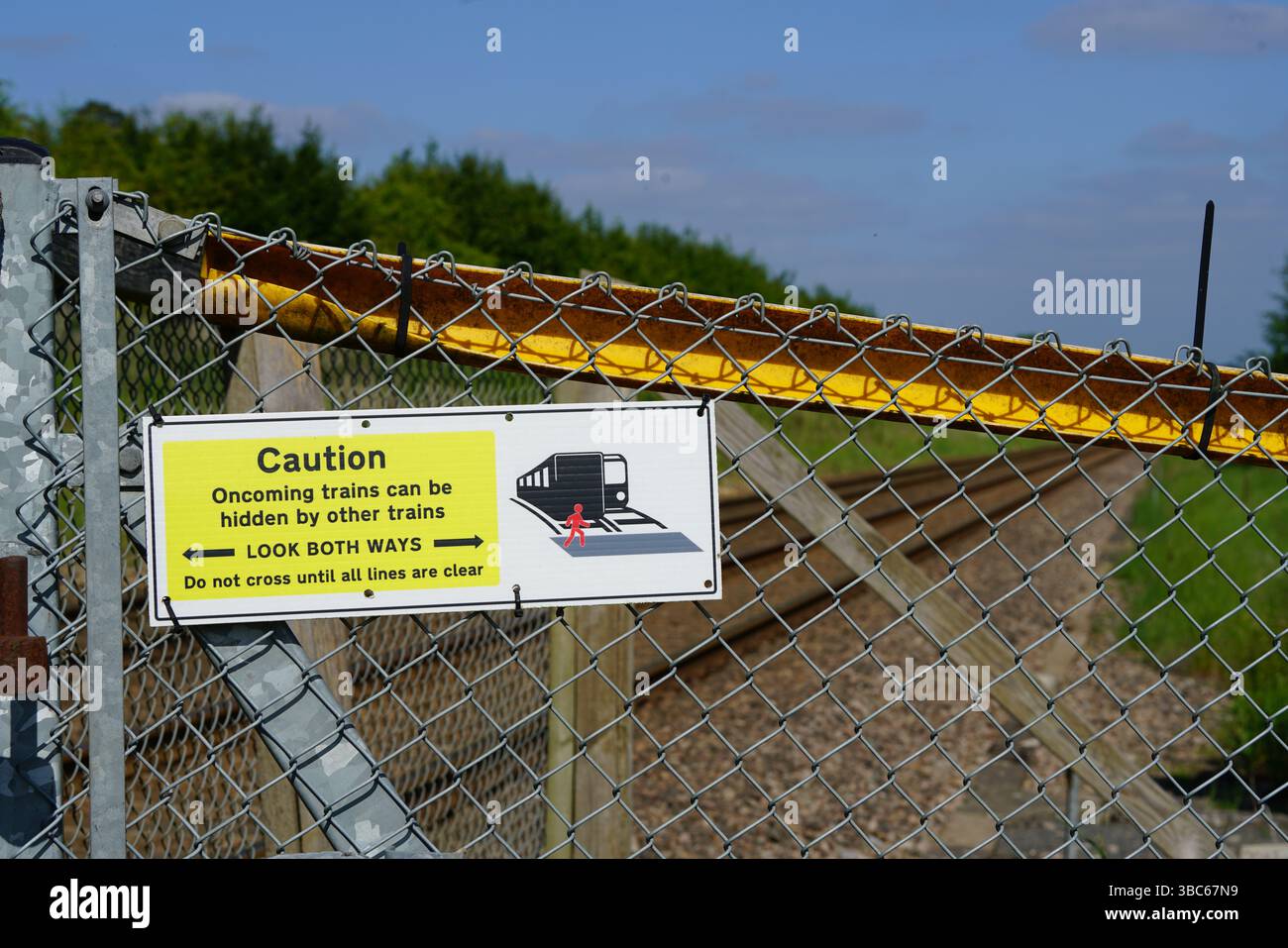 Signs at railroad crossings warning of an approaching train.Dorking, UK ...