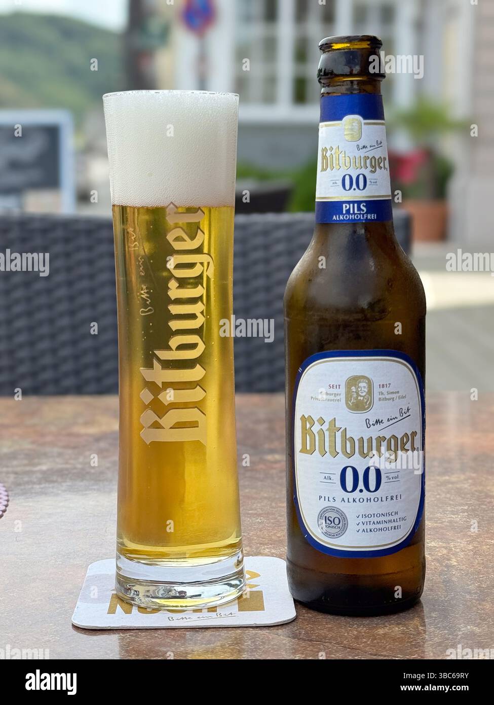 German lager beer - Bitburger zero alcohol beer.  Glass and bottle. - Smartphone Captured Stock Image