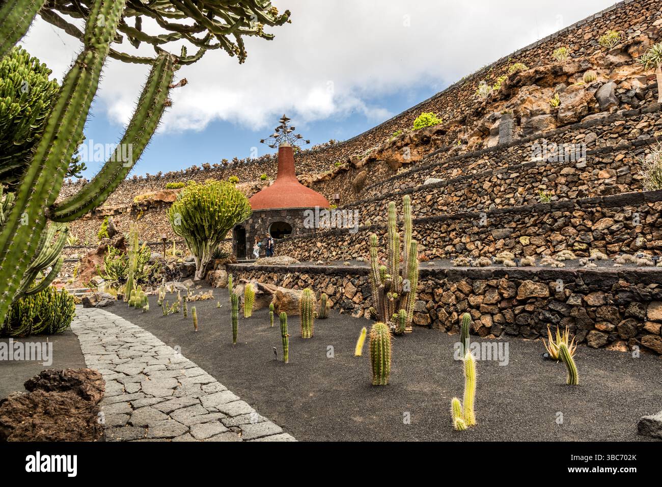 The El Jardín de Cactus cactus garden on Lanzarote is home to around 4,500 species of cacti from five continents. It was designed by César Manrique and is laid out in a former landfill site as a terraced amphitheatre with lava stone walls. Avenida Garafía, Guatiza, Canarias, Spain Stock Photo