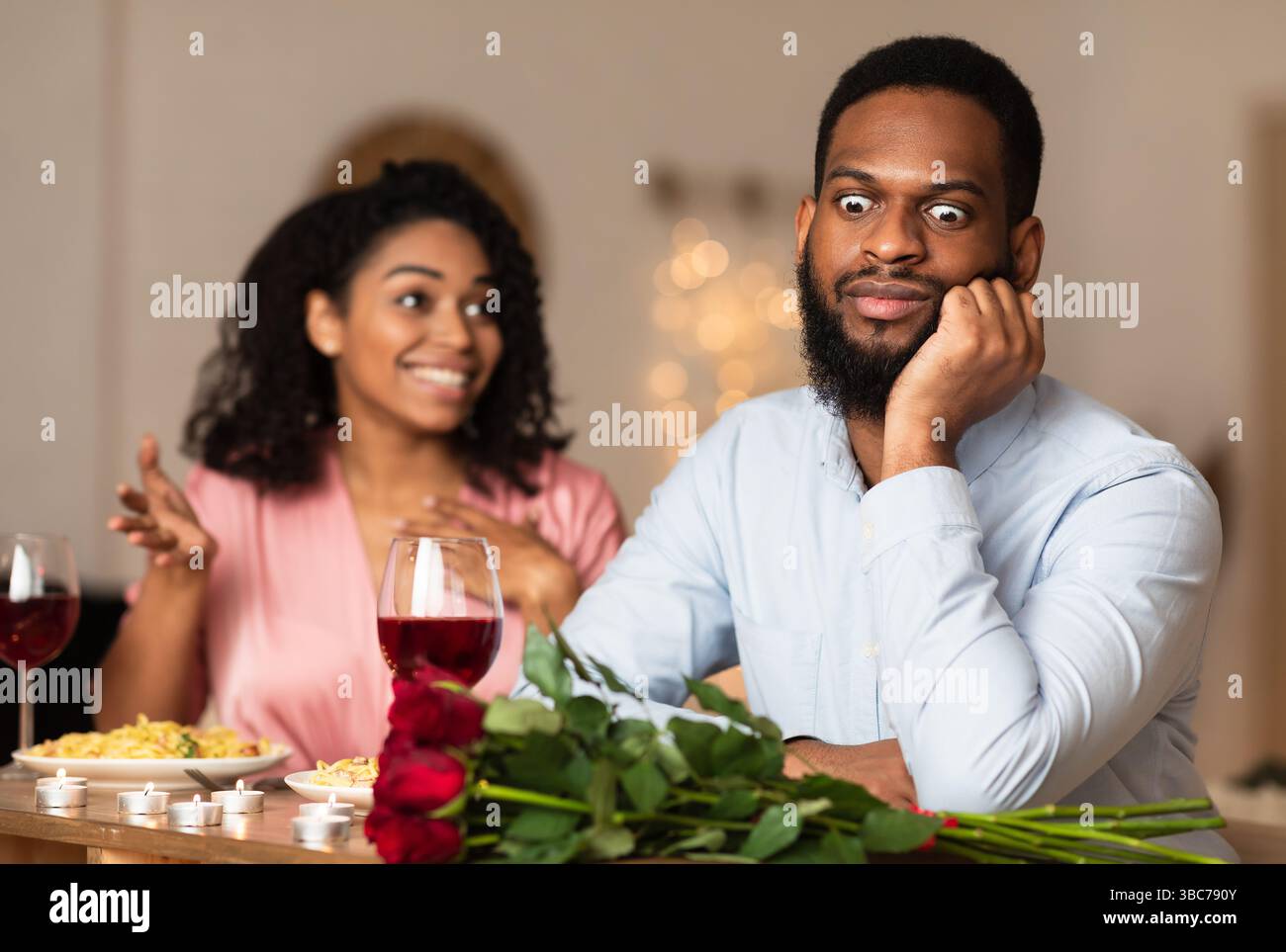 Black Man On Unsuccessful First Date In Restaurant Stock Photo