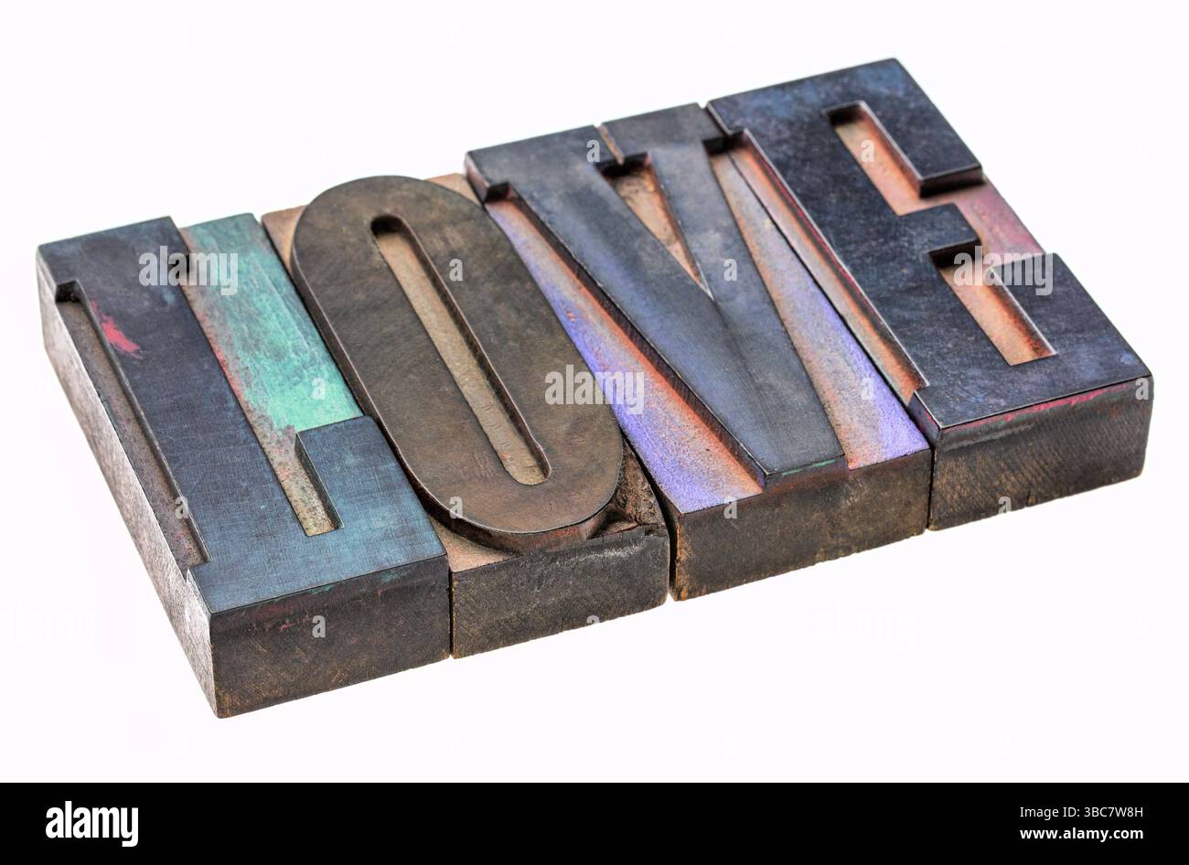 Love - isolated word abstract in vintage wooden letterpress type blocks, stained by color ink Stock Photo