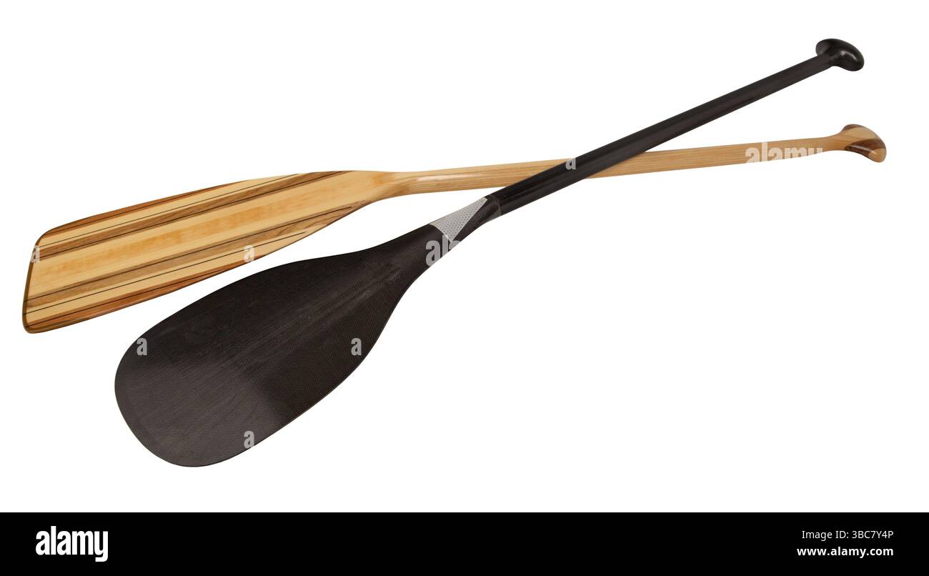 Tradition and high technology - classic wooden and racing carbon fiber canoe paddles, isolated with clipping path Stock Photo