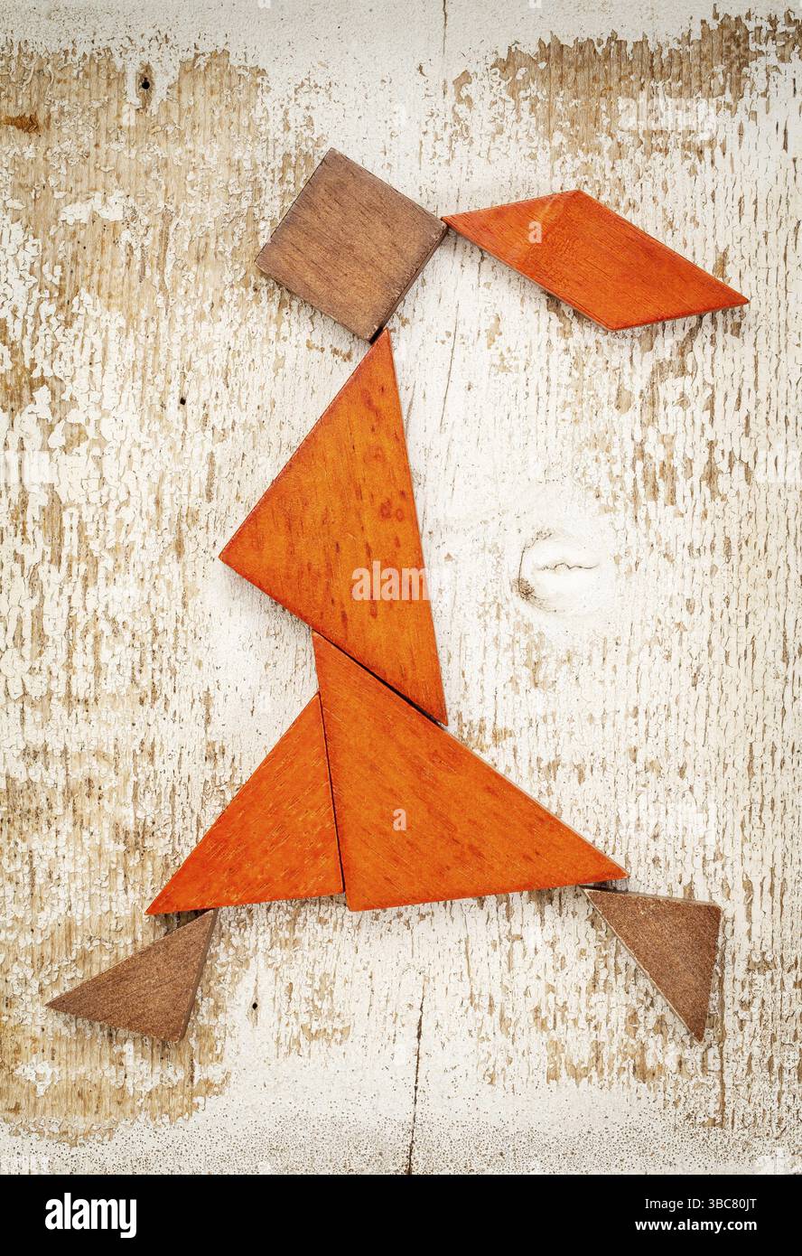 Abstract figure of a walking or running girl built from seven tangram ...