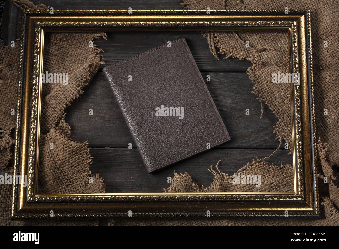 Leather wallet on a wooden table Stock Photo