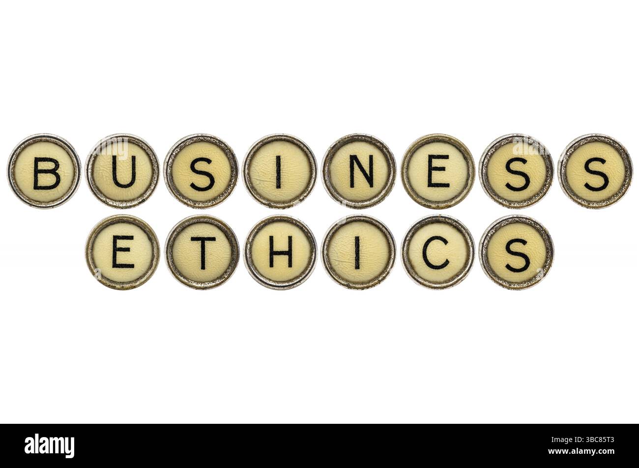 Business ethics text in old round typewriter keys isolated on white Stock Photo