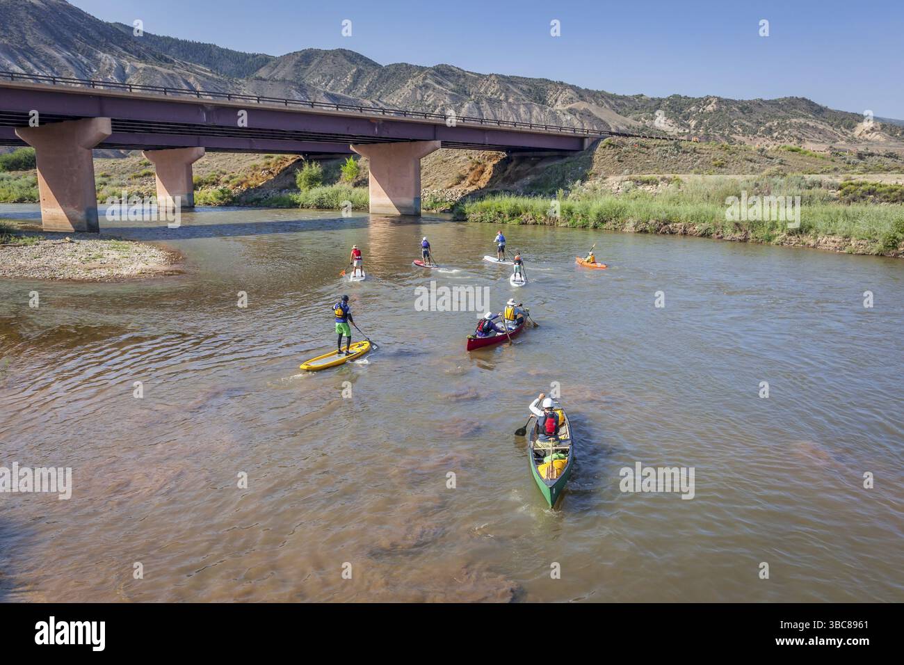 Dotsero, CO, USA - August 19, 2012: Stand up paddleboards, kayaks and canoes in the annual Colorado River Race in the Glenwood Canyon Stock Photo