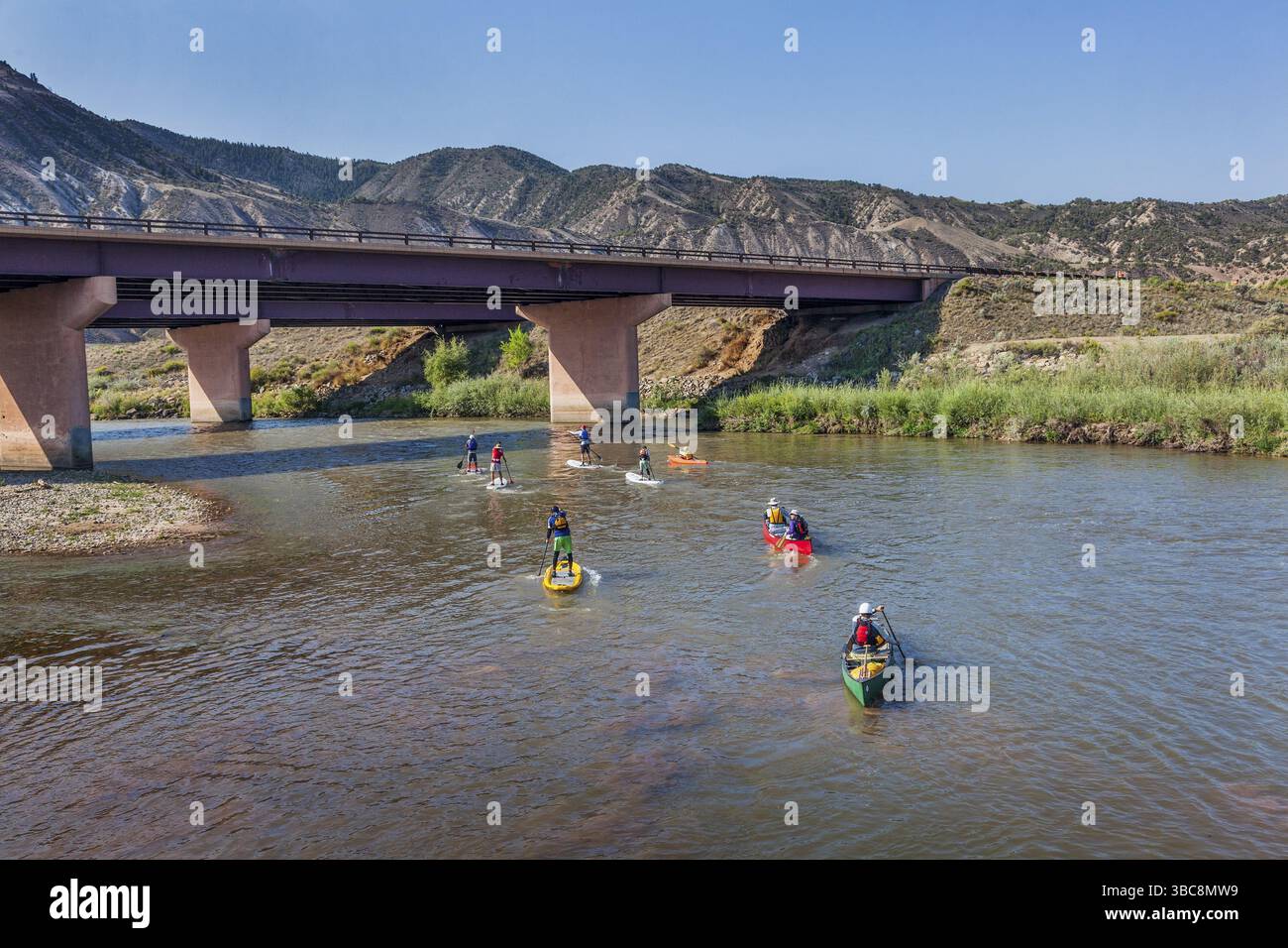 DOTSERO, CO - AUGUST 19: Stand up paddleboards, kayaks and canoes in the annual Colorado River Race in the Glanwood Canyon, August 19, 2012 Stock Photo