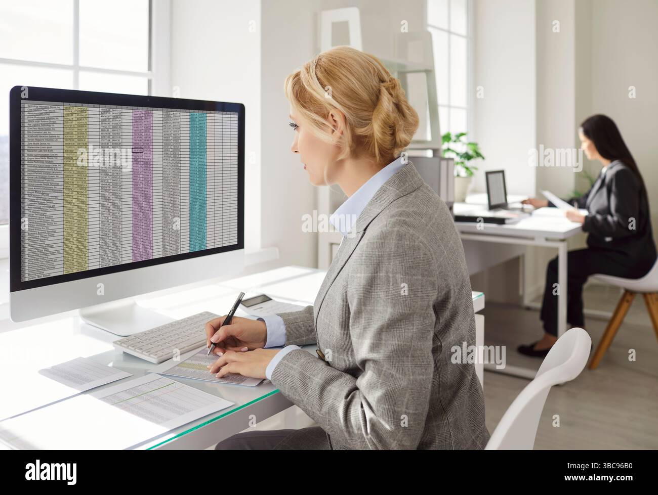 Business accountant working in office concentrated in screen on PC ...