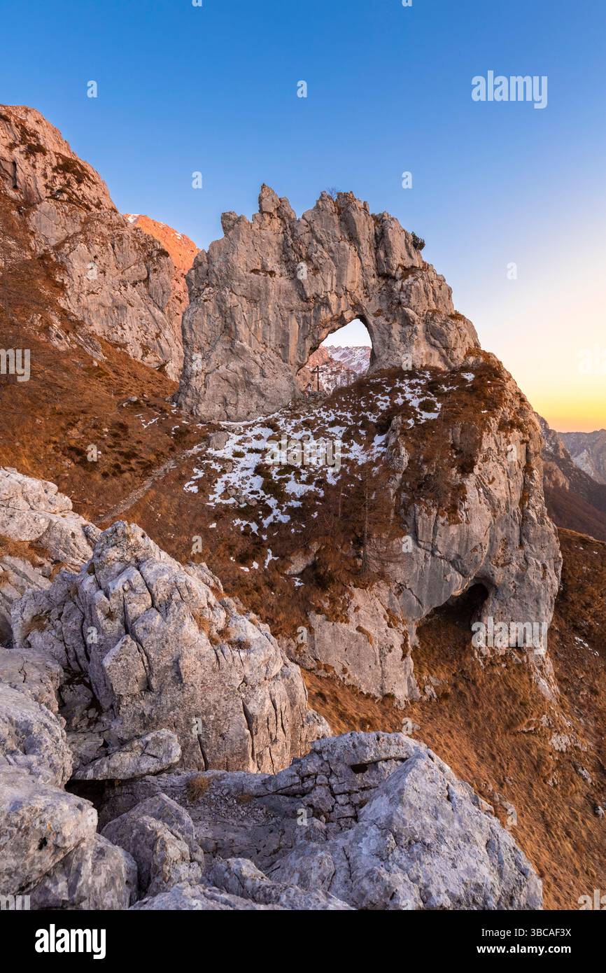 View of the Porta di Prada in the Grigna mountain in winter at sunset. Grigna Settentrionale, Mandello del Lario, Lombardy, Italy. Stock Photo