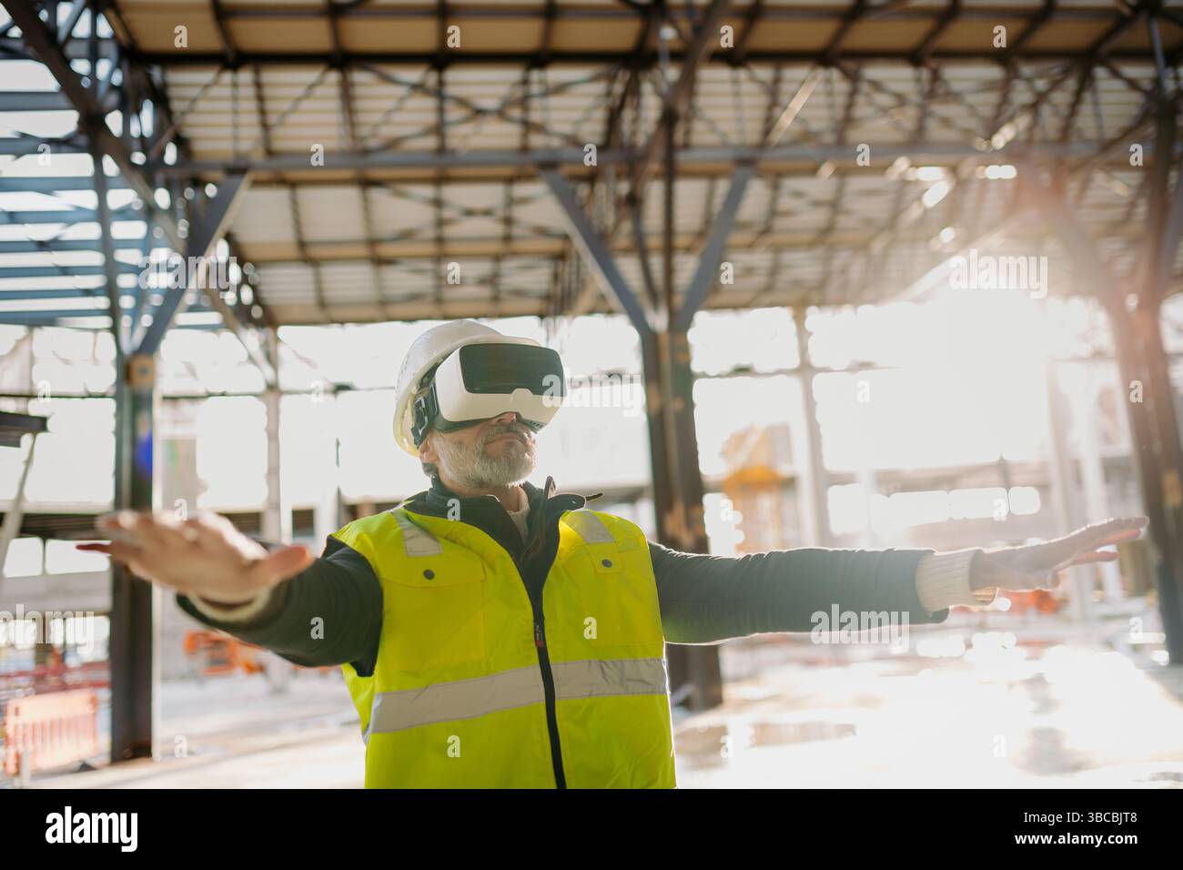 Engineer using virtual reality to inspect building progress. Stock Photo