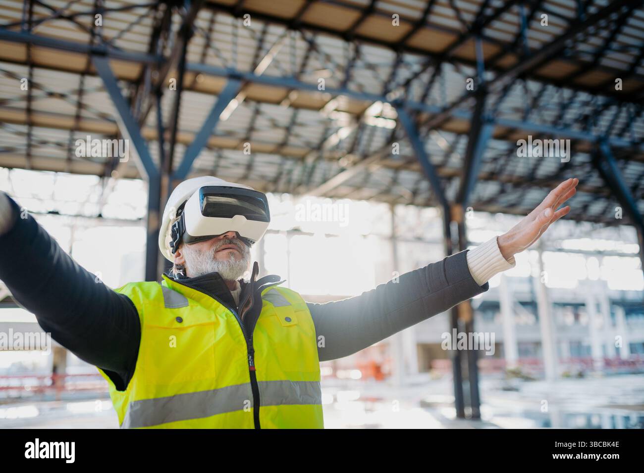 Engineer using virtual reality to inspect building progress. Stock Photo