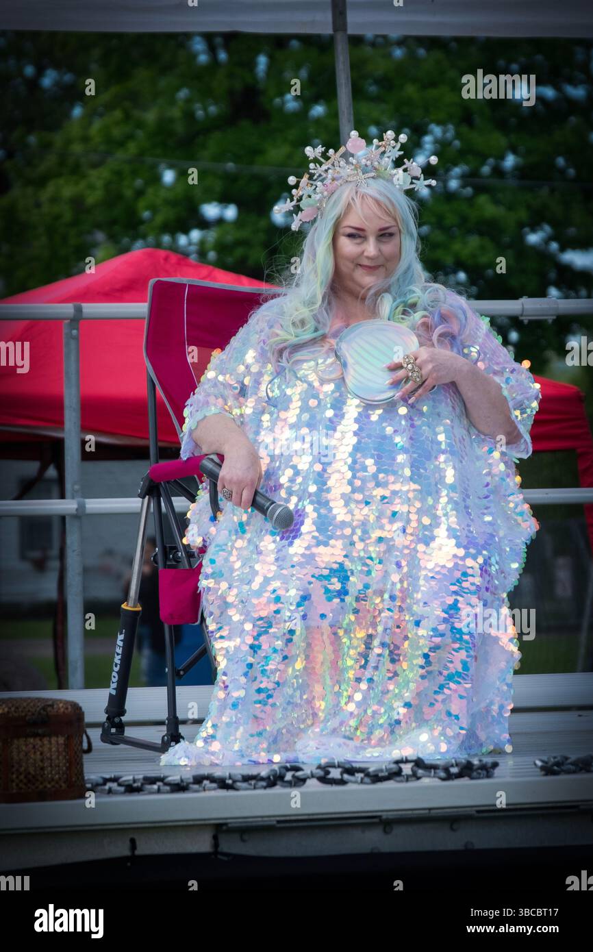 Enchantress Rapture Pearl poses on stage while her group, Witches Along the Hudson, dance at the 2025 Pirate Festival in New Paltz, New York. Stock Photo