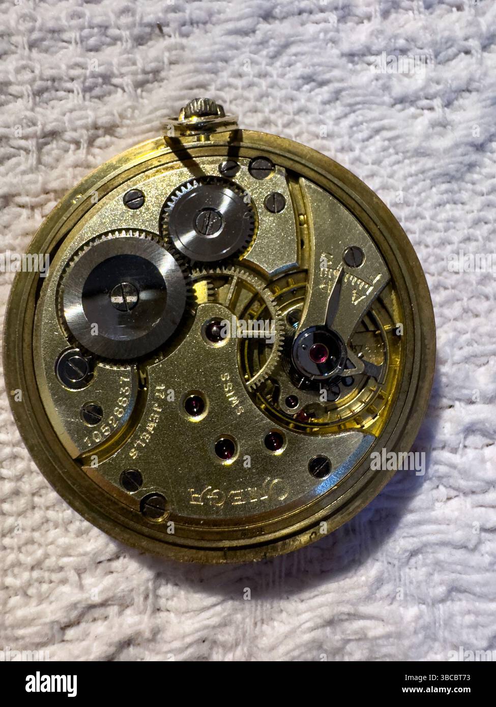 Omega gold pocket watch mechanisms, Madrid, Spain - Smartphone Captured Stock Image