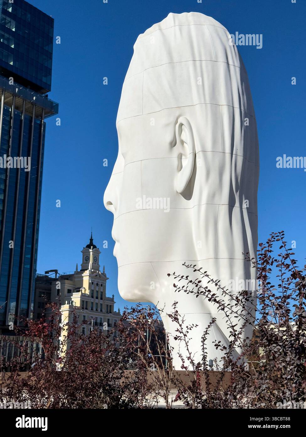 Julia, white marble sculpture by Jaume Plensa in Plaza Colon, Madrid, Spain - Smartphone Captured Stock Image