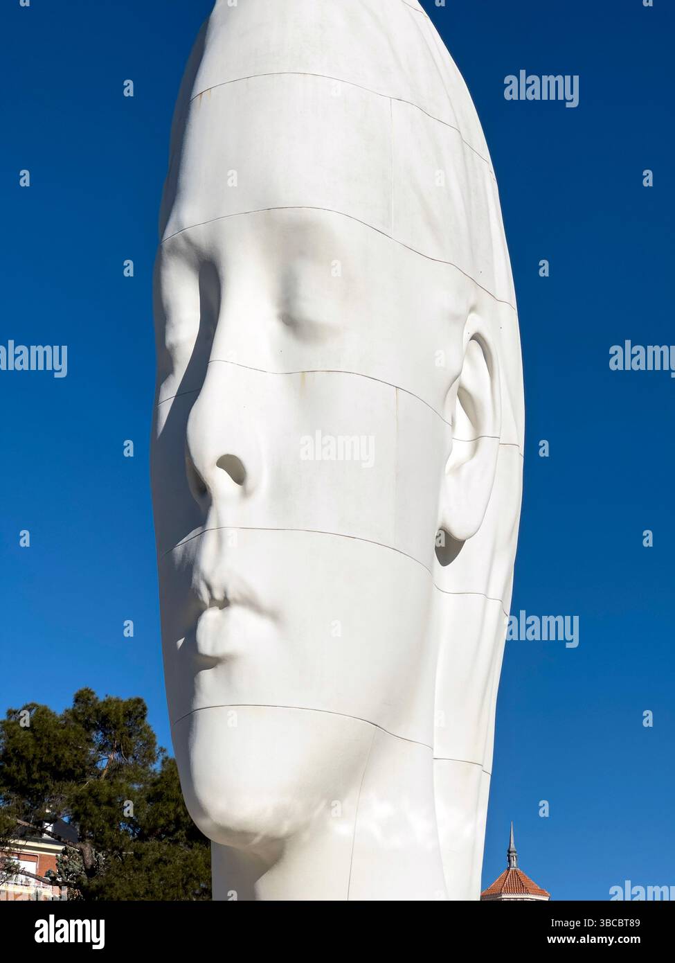 Julia, white marble sculpture by Jaume Plensa in Plaza Colon, Madrid, Spain - Smartphone Captured Stock Image