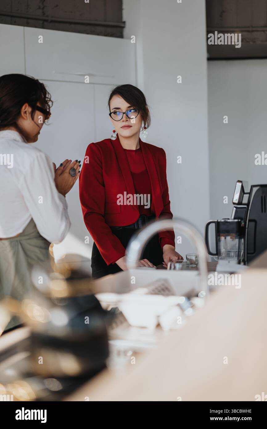 Multiracial business workers having a conversation in a modern office Stock Photo
