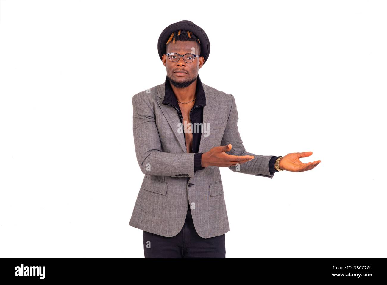 handsome young business man wearing elegant suit and pointing both hands aside. Stock Photo