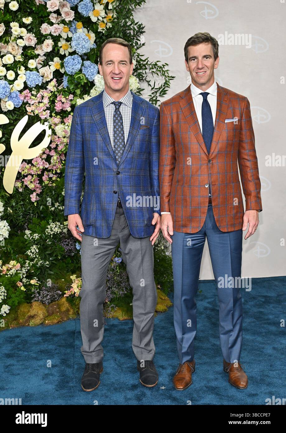 Peyton Manning, left, and Eli Manning attend the Disney 2025 Upfront ...