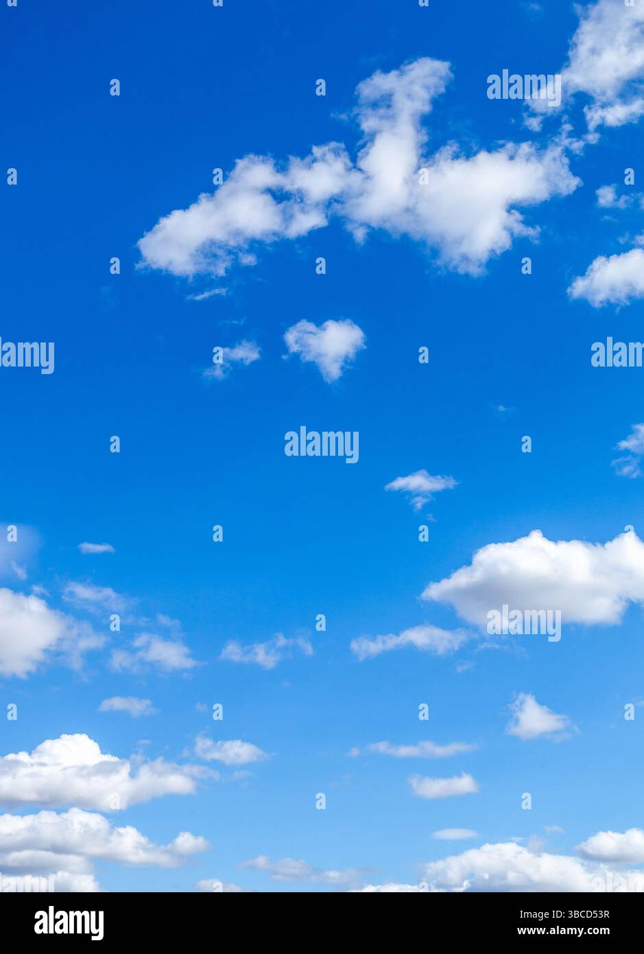 A beautiful blue sky with puffy white clouds Stock Photo - Alamy