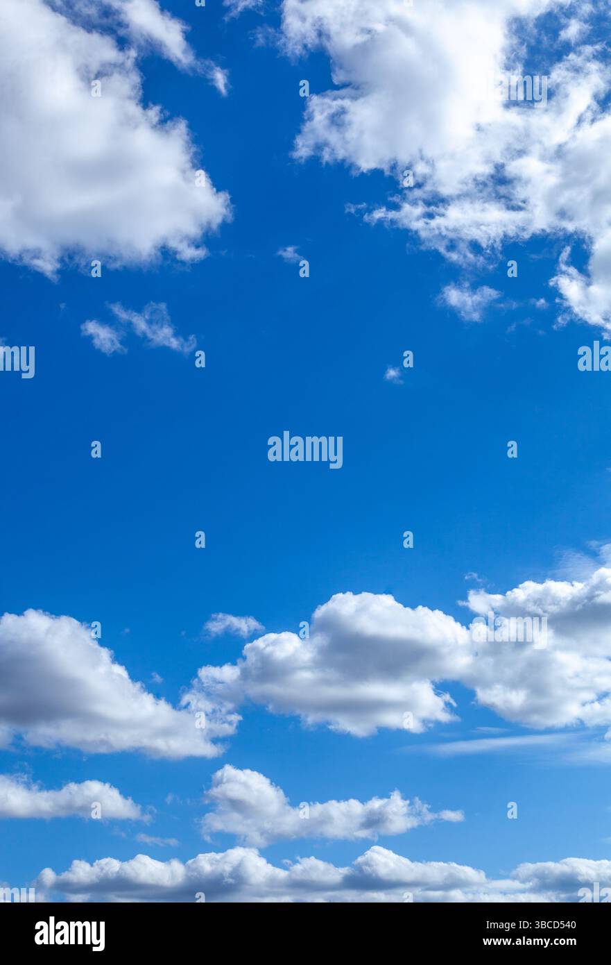 A beautiful blue sky with puffy white clouds Stock Photo - Alamy
