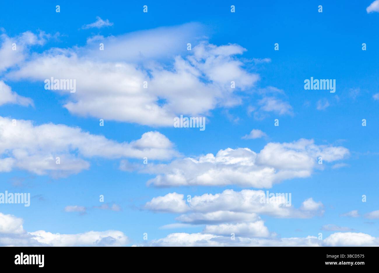 A beautiful blue sky with puffy white clouds Stock Photo - Alamy