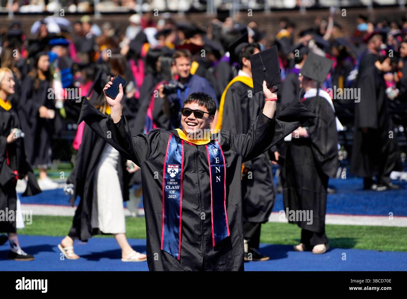 A student from the class of 2025 celebrates his graduation during the ...