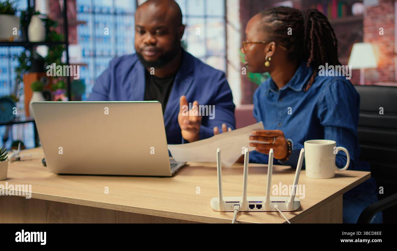 Internet Router Out Anger African american woman rebooting hi-res stock photography and images ...